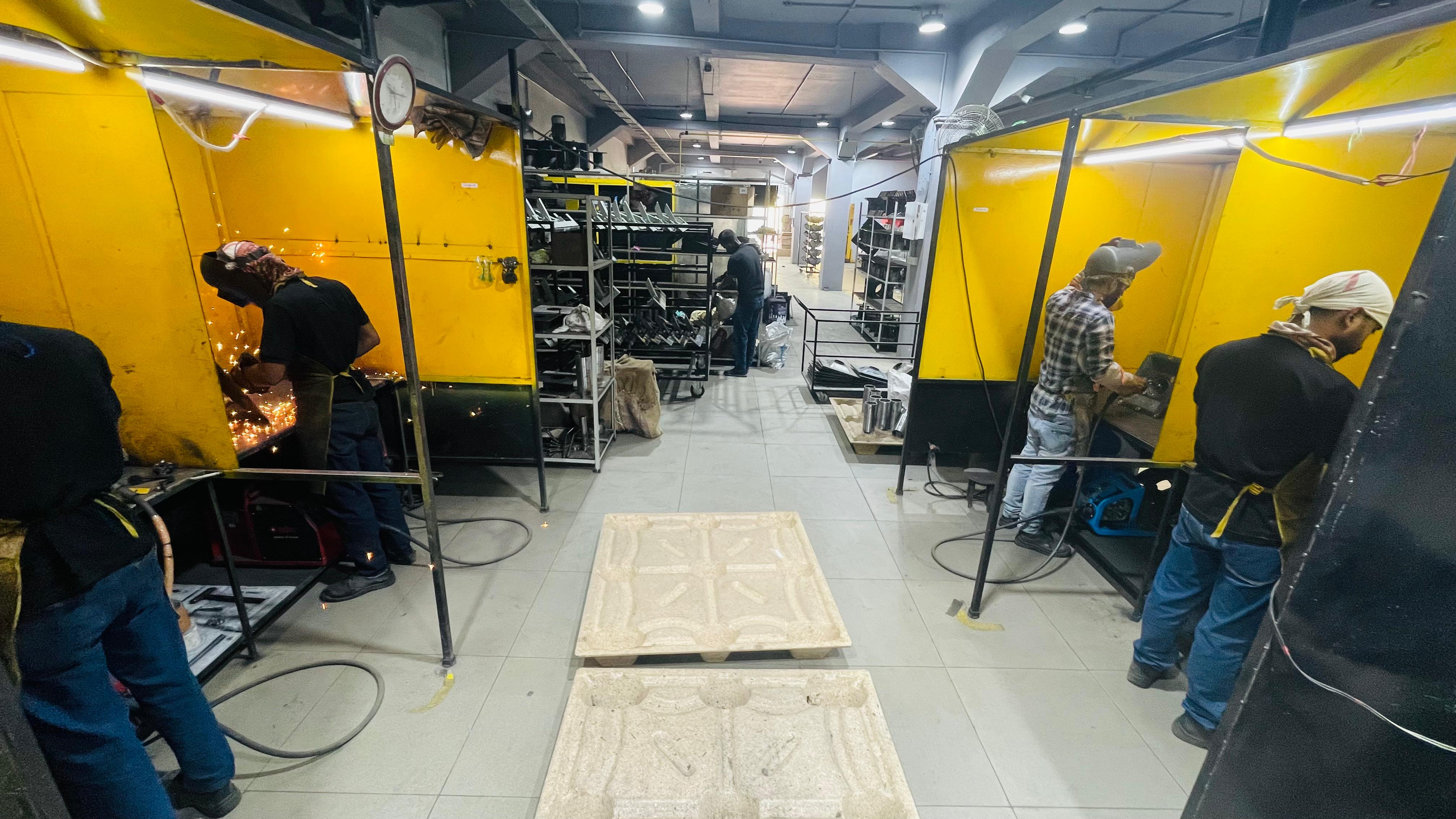 Ironthrone shop floor — fabrication and welding stations